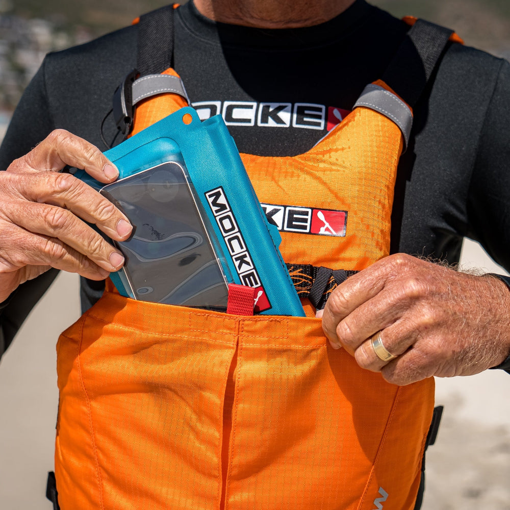 Mocke Cellphone Dry Bag turquoise, being stored in PFD pocket
