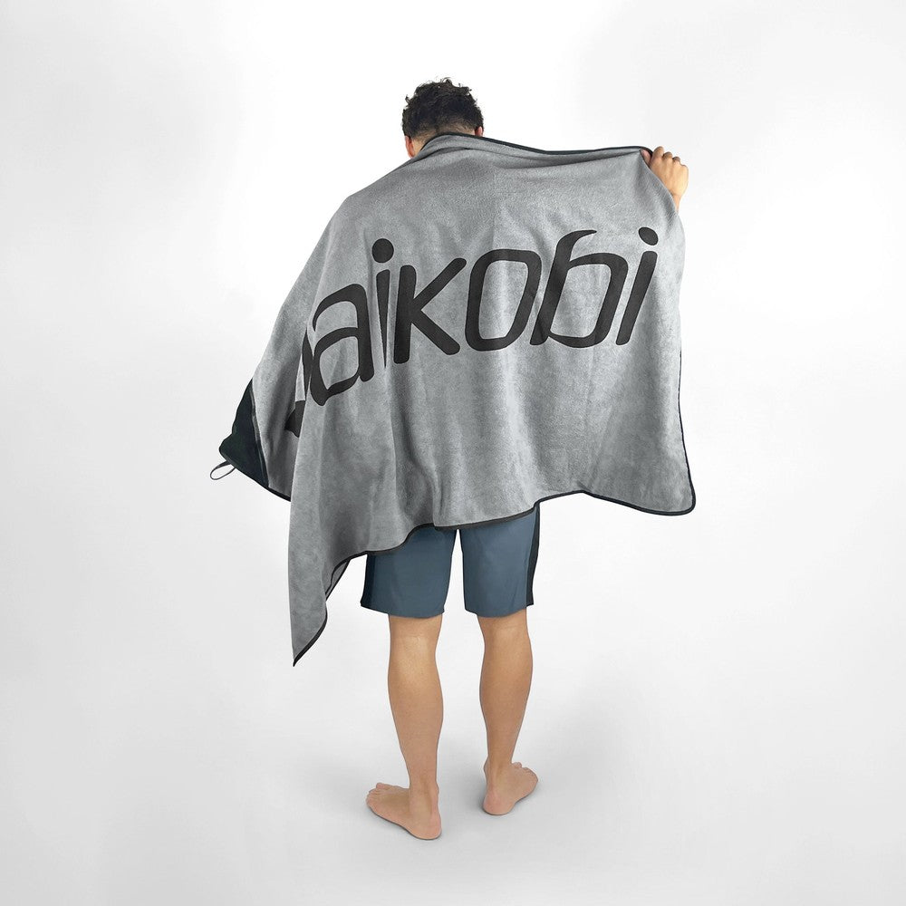 Vaikobi Beach Towel with Zip Pocket Grey - front view worn over shoulders