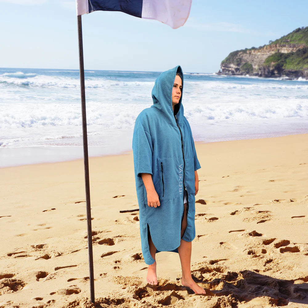 Vaikobi Hooded Change Towel ocean with female model  at beach
