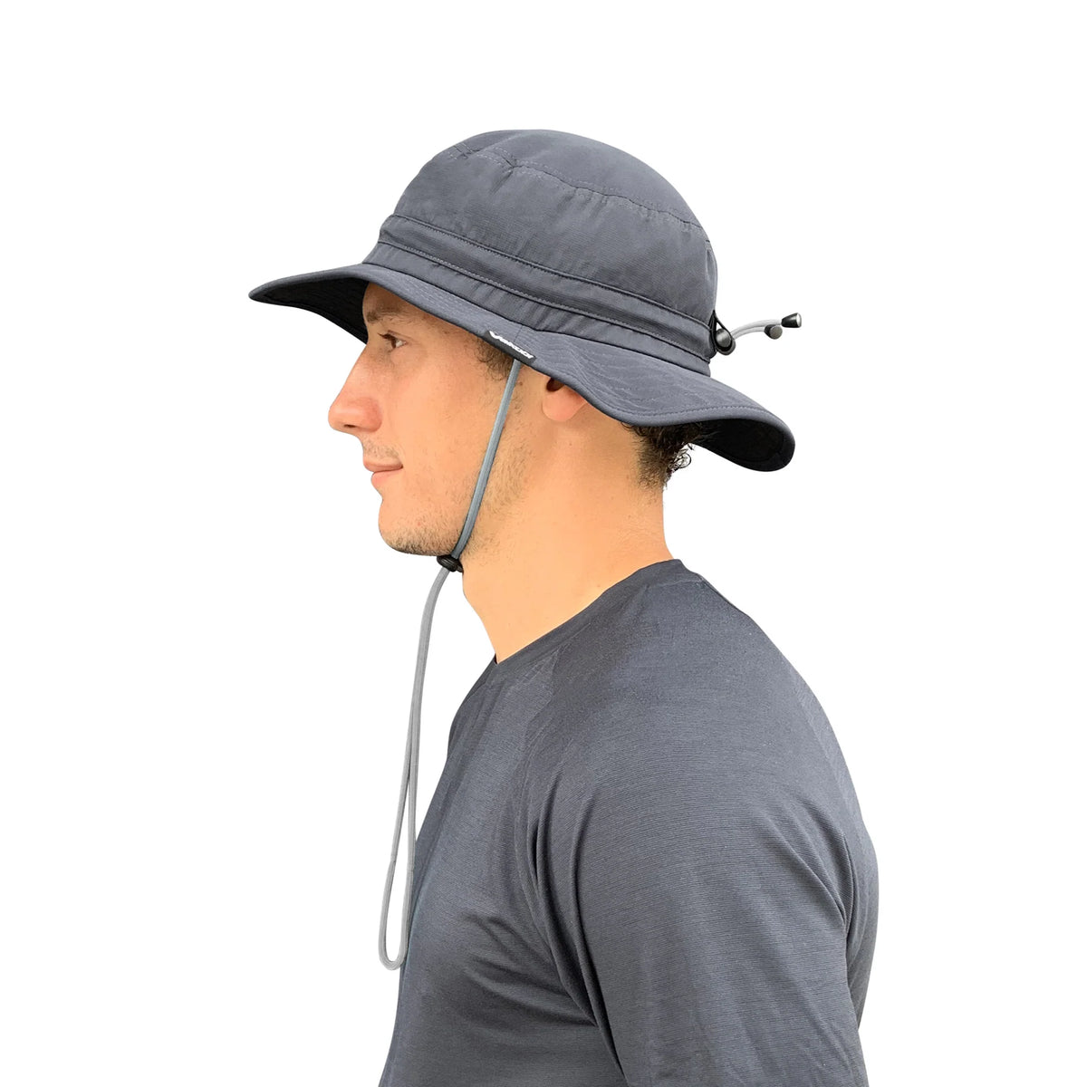 Side profile of man wearing Vaikobi UV Ocean Surf Hat in Charcoal