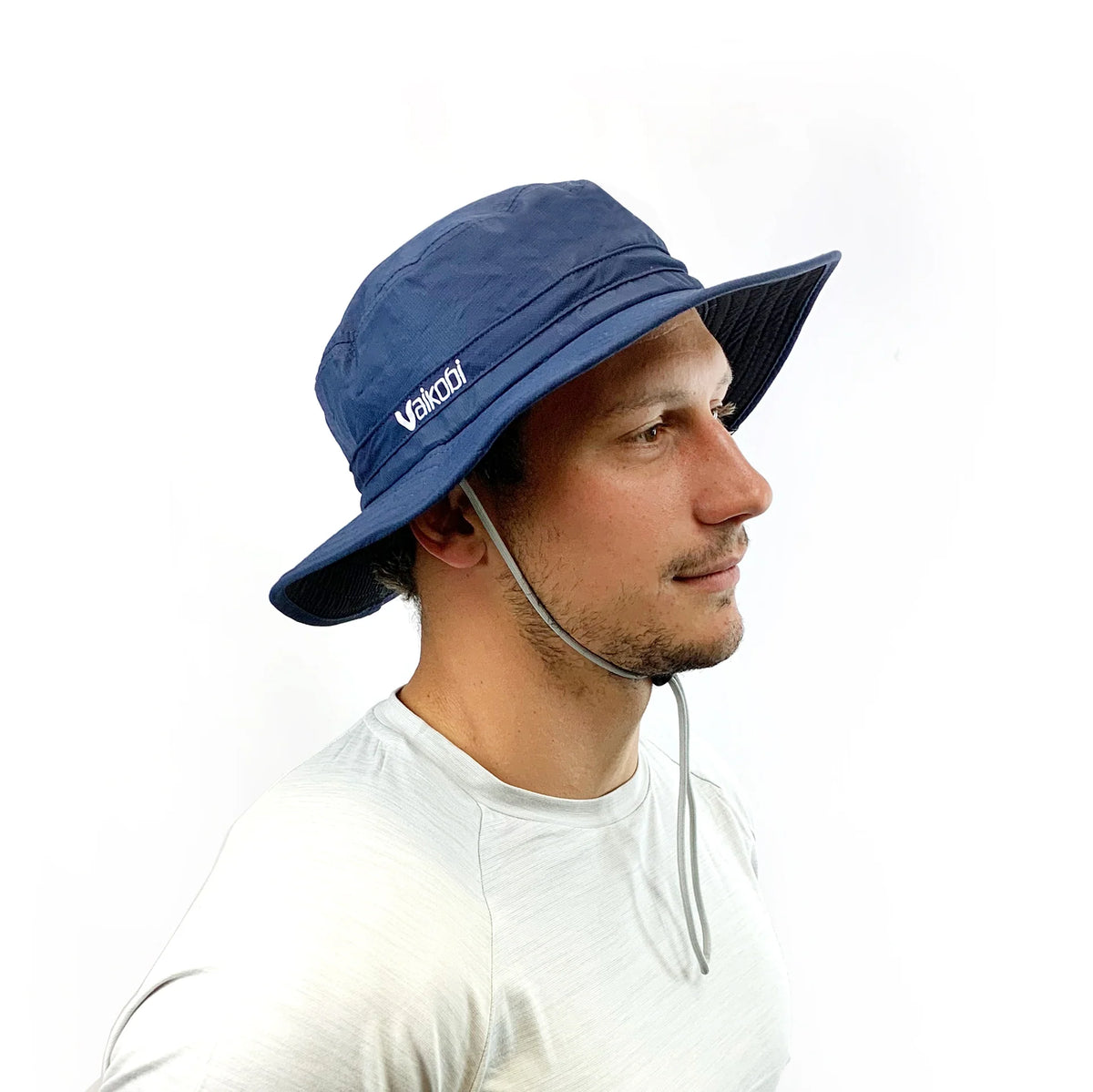 Side angle of Vaikobi UV Ocean Surf Hat in Navy