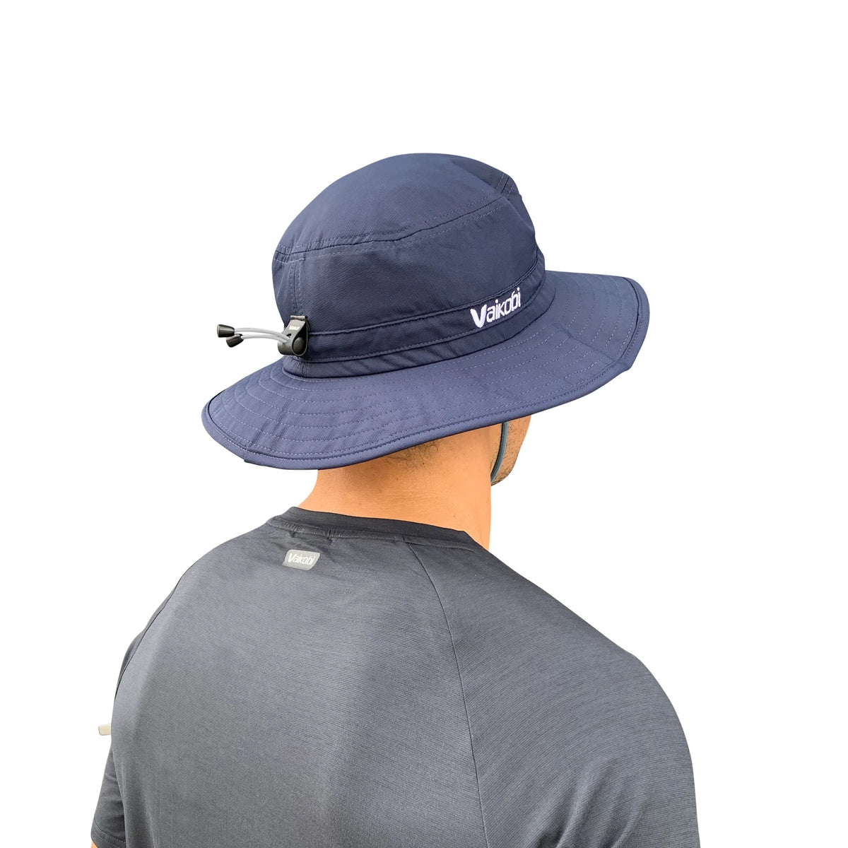 Back view of man wearing Vaikobi UV Ocean Surf Hat in Navy