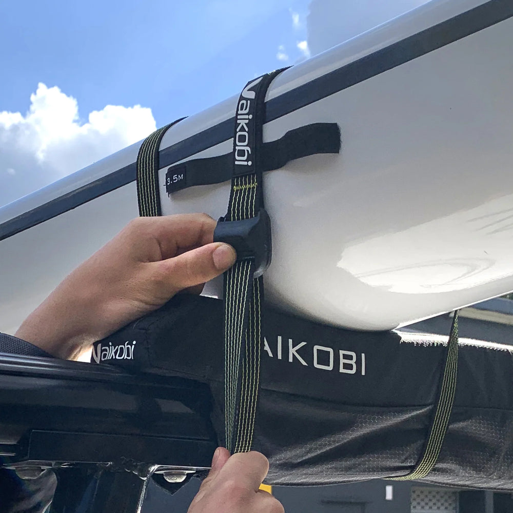 Vaikobi Tie Down Straps - for kayak transport, demonstrating surfski tying on roof rack